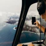Passenger takes in Puna coastline from helicopter