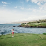 Couple golfs the Kohala Coast